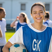 Invisalign Teen patient in Los Alamitos smiling at soccer practice