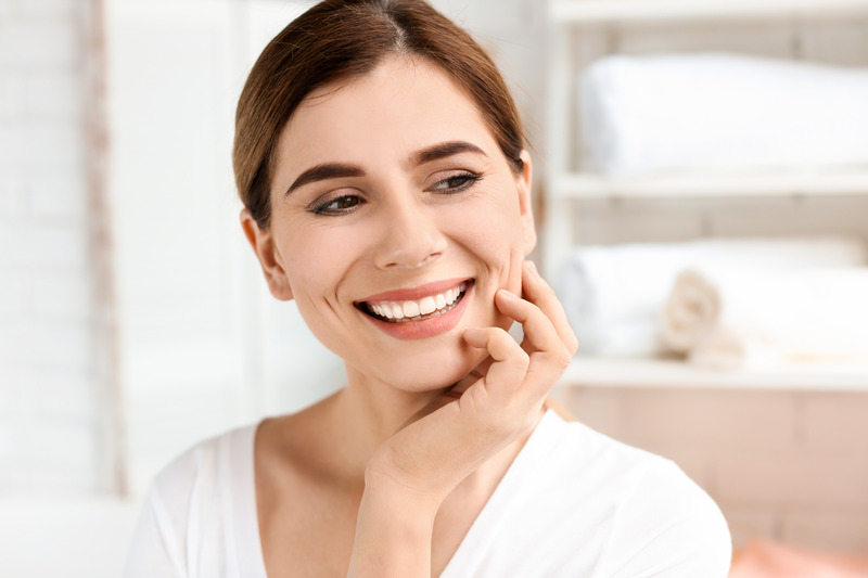 Patient smiling with their temporary veneers